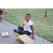 Little girl with pile of 2x4 chunks