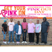 Staff with Get your pink on banner