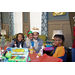 Kids at table with toys from the holiday breakfast