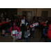 Kids showing off gifts they received at holiday breakfast