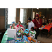 Kids and their parents looking over table of gifts