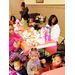 Adult and children guests seated around table for breakfast