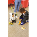 two little boys examining their toys