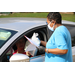 giving table giftbag through car window