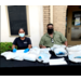 Executive Director Antonio D. Williams and Tarisha Duson at table wearing masks and handing out giftbags