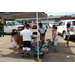 Kids gathering around a booth at the youth event