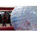 Kid inside an inflatable bumper ball