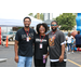 A woman and two men smiling for the camera