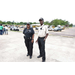 Two security guards standing next to each other.