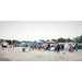 A wide view of the crowd and many tents set up.