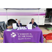 Two women smiling at the Christus St. Michael Health System Booth.
