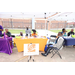 A wide shot of a group of people sitting at the RoseHill table. 