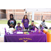 A group of children representing the Scholars booth. 