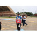 A person holding their prize which is a Raising Cane chicken finger bag.