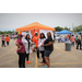 A group of people standing in front of a tent.