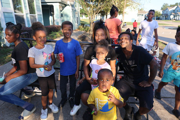 Group of children and adults posing for a photo.