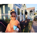 Young girl with bow in her hair posing for a photo. 