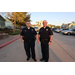 Two police officers standing for a photo. 