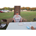 Woman wearing a red, white, and BBQ shirt. 