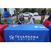 Two women sitting at a Texarkana College booth. 
