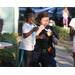 A female officer and a young girl enjoying a snack. 