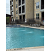  Courtyard view of the pool and lounging chairs at Waterview Crossing. 