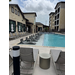  Long shot of courtyard view of the pool and lounging chairs at Waterview Crossing. 