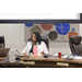  Melva Flowers sitting in the conference room. 